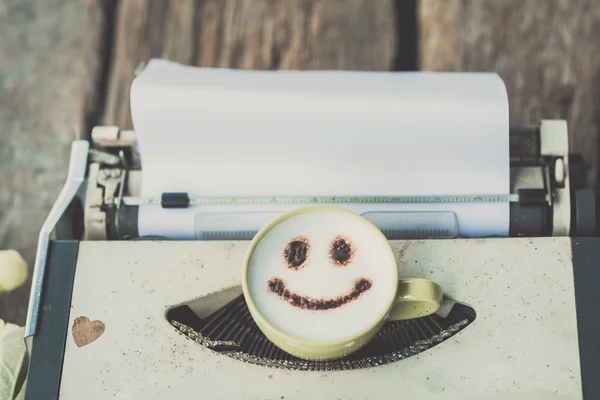 Typewriter with coffee cup, sepia tone. — Stock Photo, Image