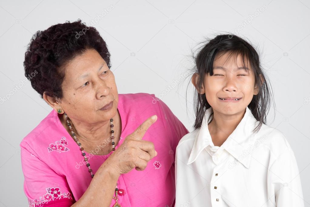 grandmother scolds her grandchild.