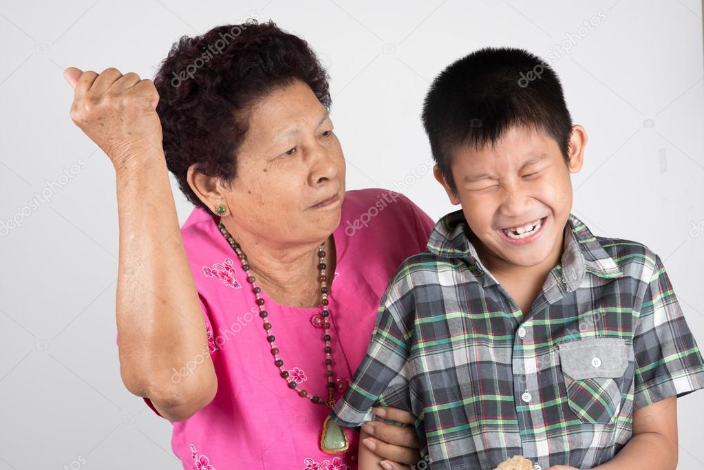 grandmother scolds her grandson.
