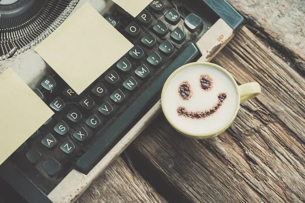 Typewriter with coffee cup, sepia tone. — Stock Photo, Image