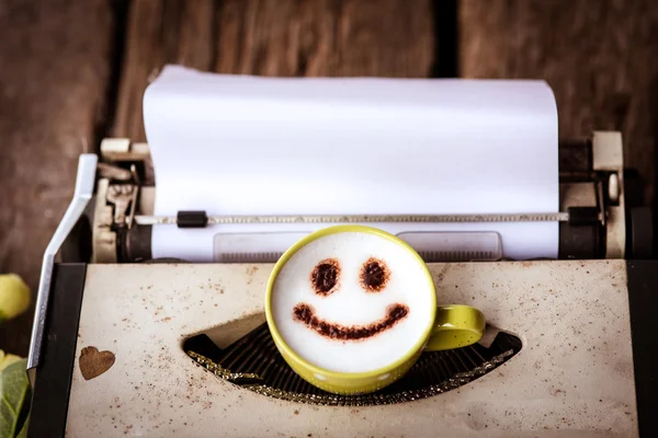 Typewriter with coffee cup, sepia tone. — Stock Photo, Image