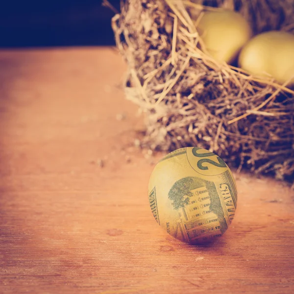 Golden eggs with dollar, wealth concept. — Stock Photo, Image