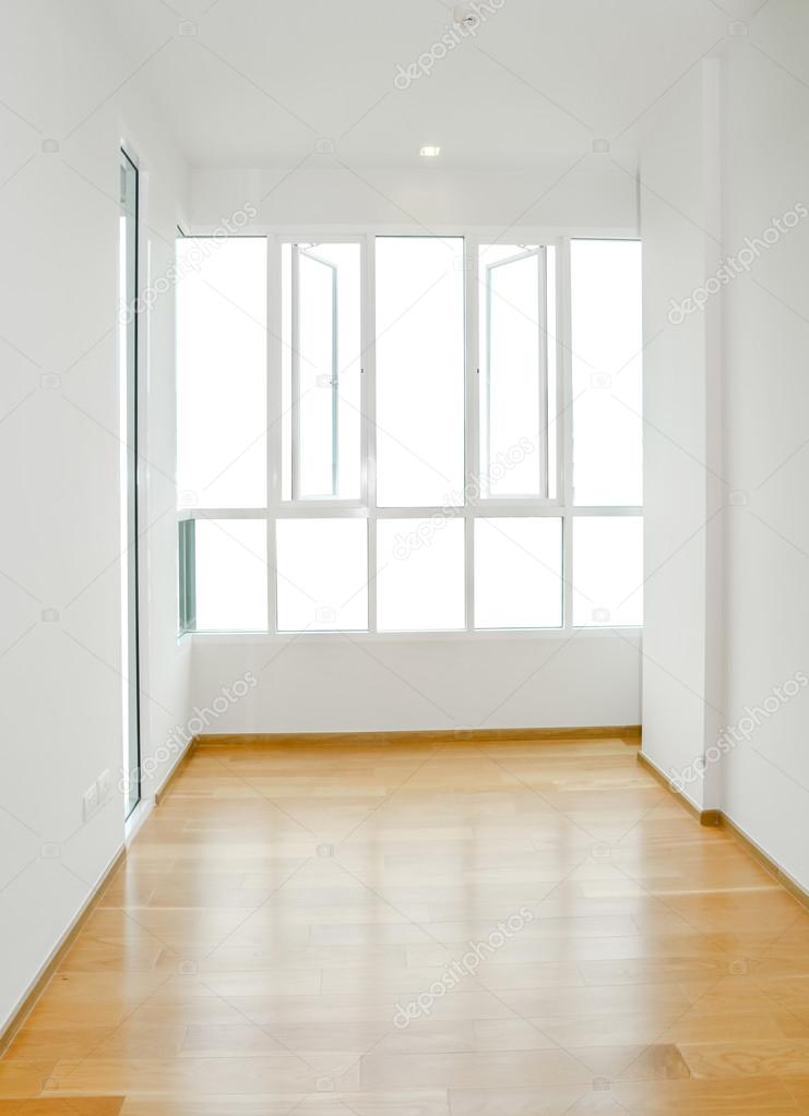 Newly constructed house interior room with unfinished wood floor