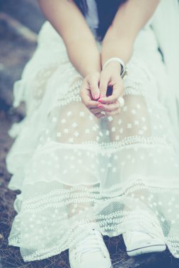 Bride 's hands in vintage tone.