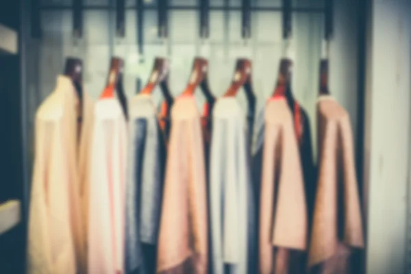 Tunics on hangers in vintage tone. — Stock Photo, Image
