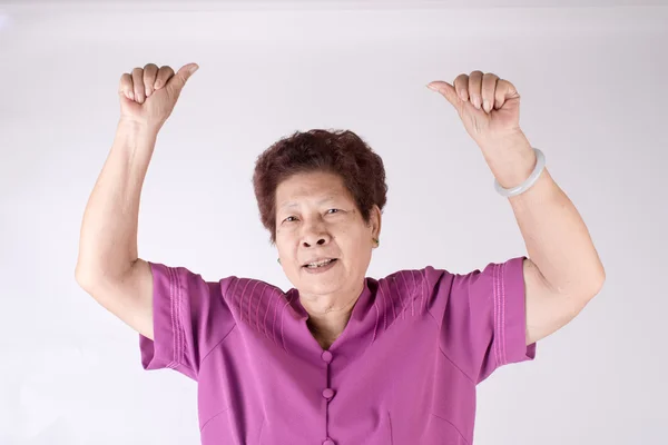 Starší žena zvedla ruce nahoru — Stock fotografie