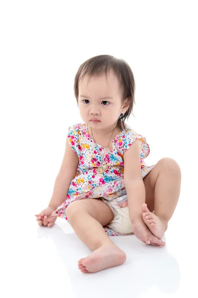 Cute Asian girl sitting  on white background. — Stock Photo, Image