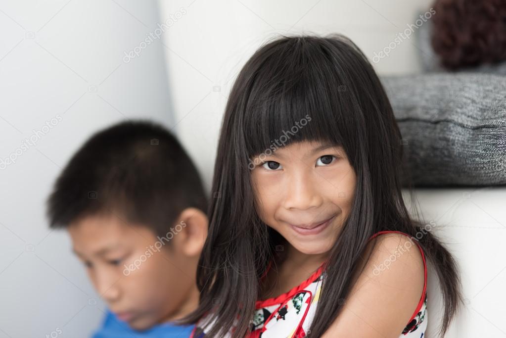 Children playing smartphone and tablet