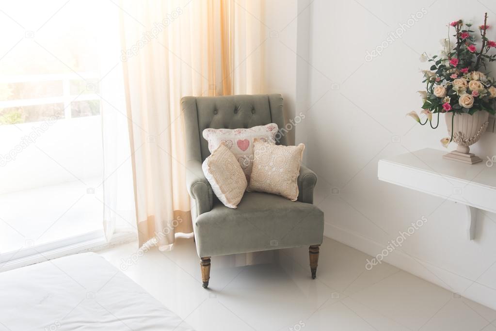 classic chair with brown pillows