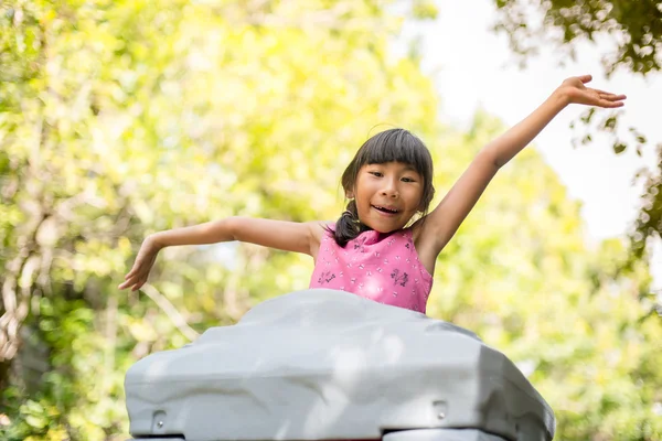 Happy Asian chidren playing at playground outdoor. — Stock Photo, Image