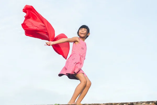 Motion ready to jumping to the sky with red fabric. — Stock Photo, Image