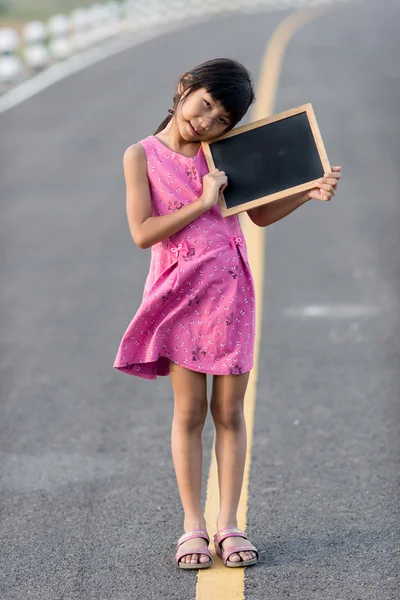 Asian girl on road — Stock Photo, Image