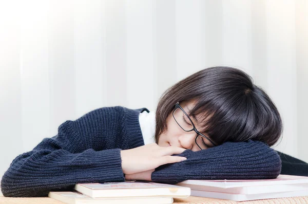 Very tired/exhausted, pretty, female student with books working — Stock Photo, Image