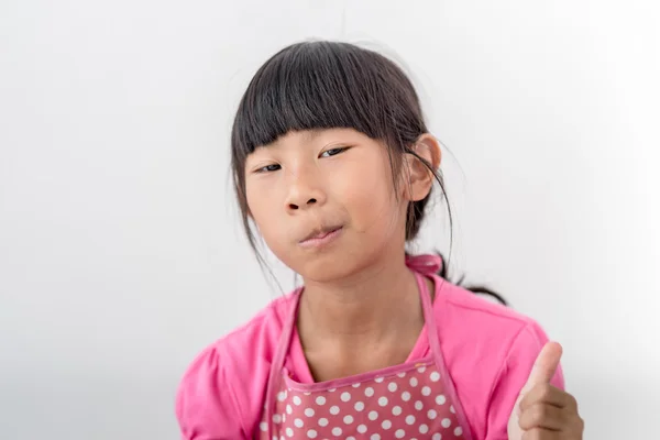 Menina asiática comendo pão em casa . — Fotografia de Stock