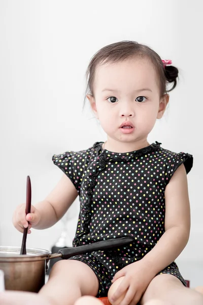 Asian child playing a chef at home. — Stock Photo, Image