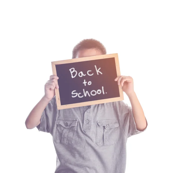 Asian boy holding with Back to school message on black board — Stock Photo, Image