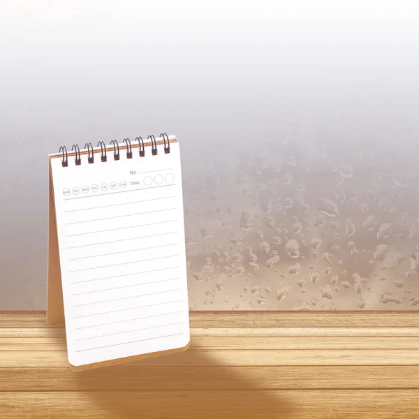 Notebook with  rainy day window background — Stock Photo, Image