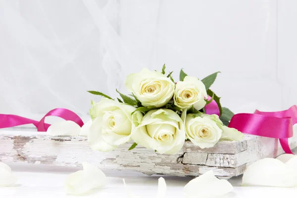 Five white roses with pink ribbon — Stock Photo, Image