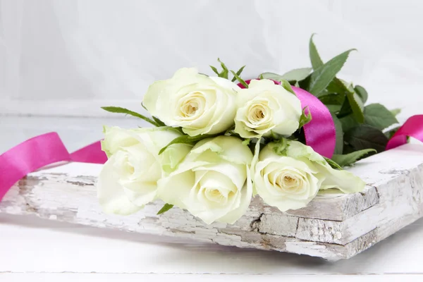 Five white roses with pink ribbon — Stock Photo, Image