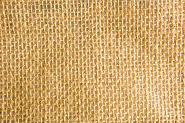 Çuval bezi dokusu, doğal liften yapılmış kaba dokuma, sarı-kahverengi renk. Kopyalama alanı, yakın plan
