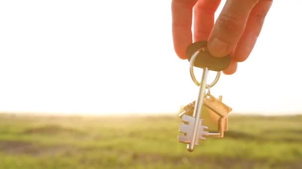 House Key Keychain Hand Background Sky Sunlight Field Dream Home — Stock Video