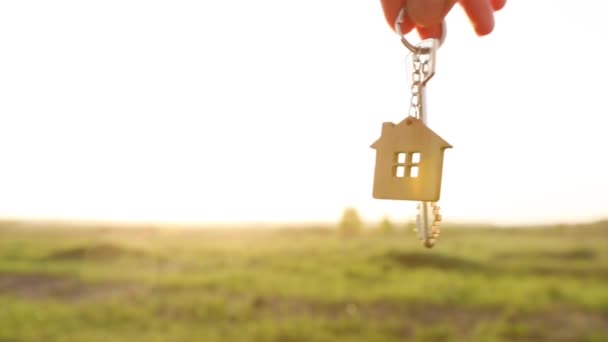 House Key Keychain Hand Background Sky Sunlight Field Dream Home — Stock Video