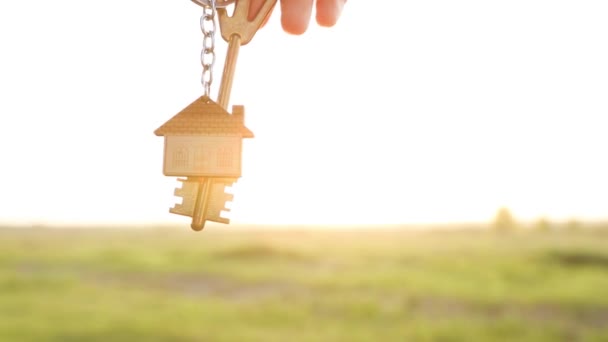 House Key Keychain Hand Background Sky Sunlight Field Dream Home — Stock Video