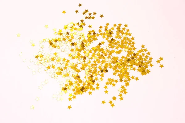 Lantejoulas Douradas Forma Estrelas Brilham Sobre Fundo Rosa Fundos Com — Fotografia de Stock