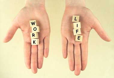 Work and life. Female hands with cubes on light background. Concept of balance, harmony, no stress, imbalance. Choice