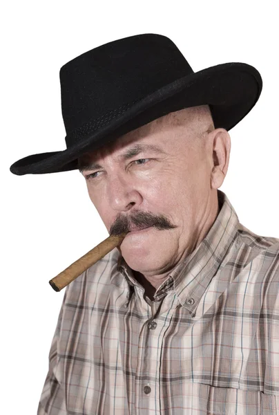 El vaquero con bigote, con un sombrero negro fumando un cigarro — Foto de Stock