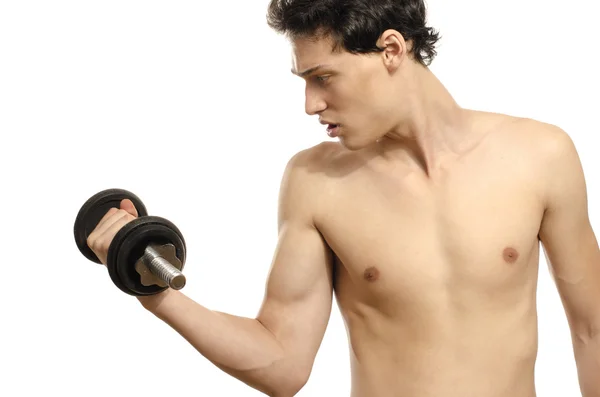 Hombre flaco entrenando su músculo bíceps. Hermosa adolescente levantando una dumbbell.Anorexic joven entrenamiento para ser más fuerte — Foto de Stock