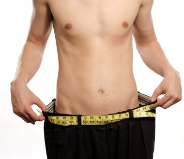 Geniş pantolonlu, anoreksik görünüşlü, zayıf vücutlu sıska bir genç. Adam kilo verdi ve şişman olduğu günlerden daha büyük pantolonunu karşılaştırdı. Öncesinde ve sonrasında, şişman veya zayıf