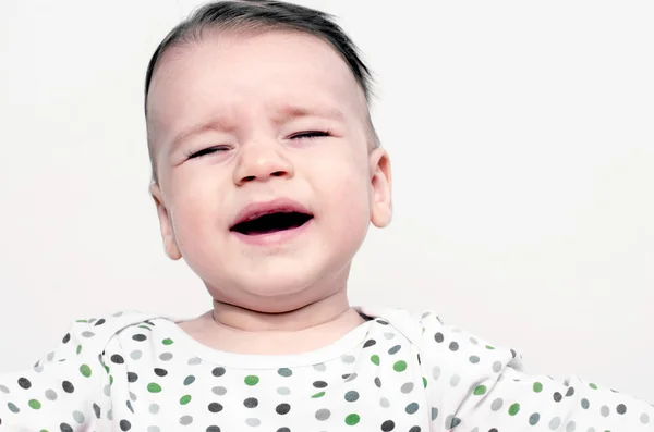 Retrato de um bebê chorando, criança chateada, bebê gritando Imagem De Stock