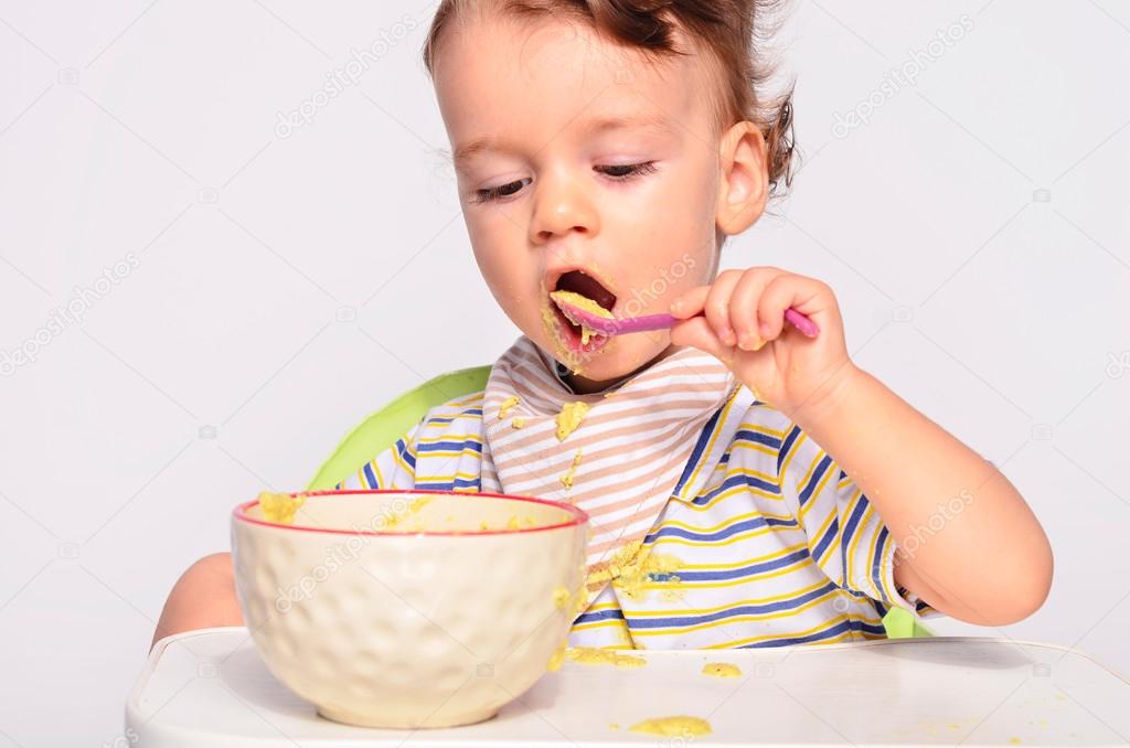 Baby eating best sale from spoon