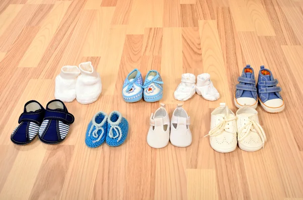 Baby boy shoes arranged in a line. — Stock Photo, Image