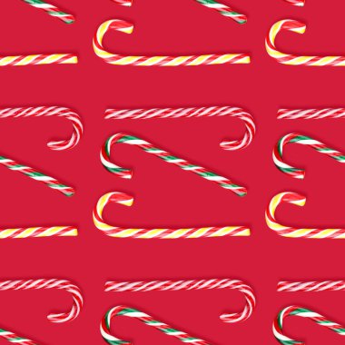 Çubuk şeker deseni Noel 'de kırmızı arka planda lolipoplar.