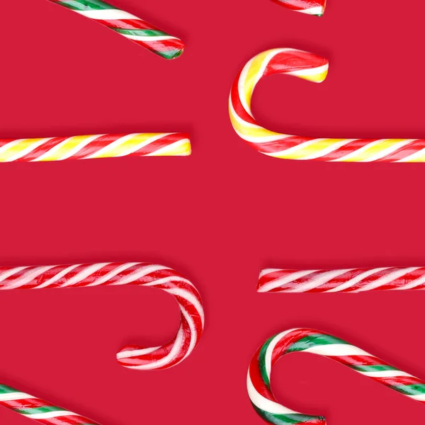 Candy canes lollipops christmas on a red background — Stock Photo, Image