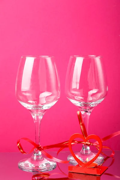 Two Champagne Glasses Red Ribbons Pink Background Heart Shaped Candlestick — Stock Photo, Image