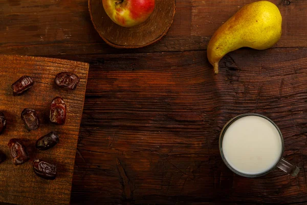 Iftar food for Ramadan fasting dates, fruits and milk ayran. Horizontal photo