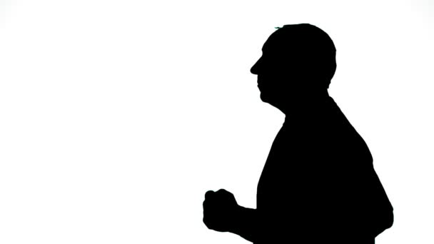 Silhouette eines Mannes im Profil auf weißem Hintergrund — Stockvideo