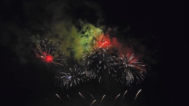 Sparkling multicolored fireworks spark mix against the dark night sky — Stock Video