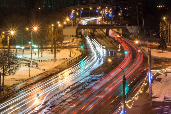 Blurred Tail Lights And Traffic Lights