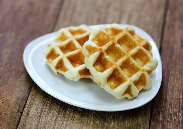 Freshly baked waffles close up on the wood — Stock Photo, Image