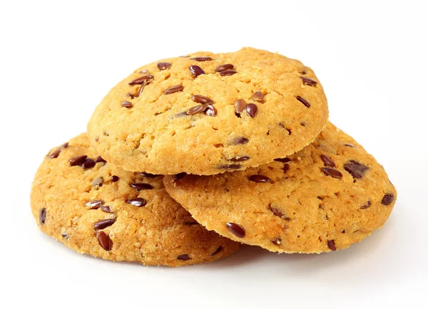 Celá zrna, soubory cookie na bílém pozadí — Stock fotografie