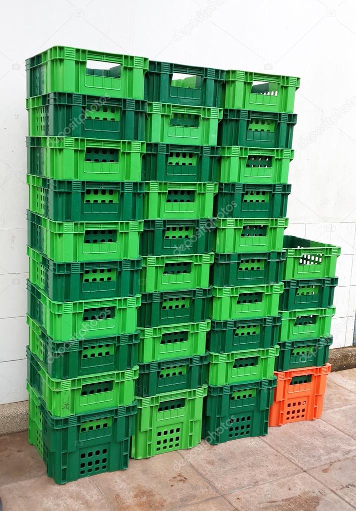 Bright Color Plastic Containers Piles beside supermarket