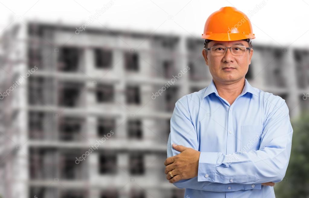 Business engineer at construction site background