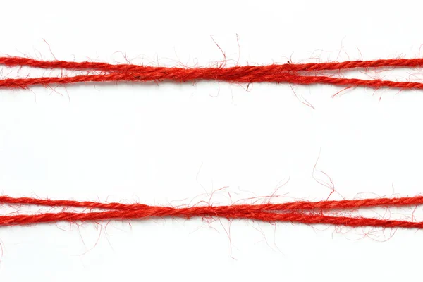 String vermelho como moldura no fundo branco — Fotografia de Stock