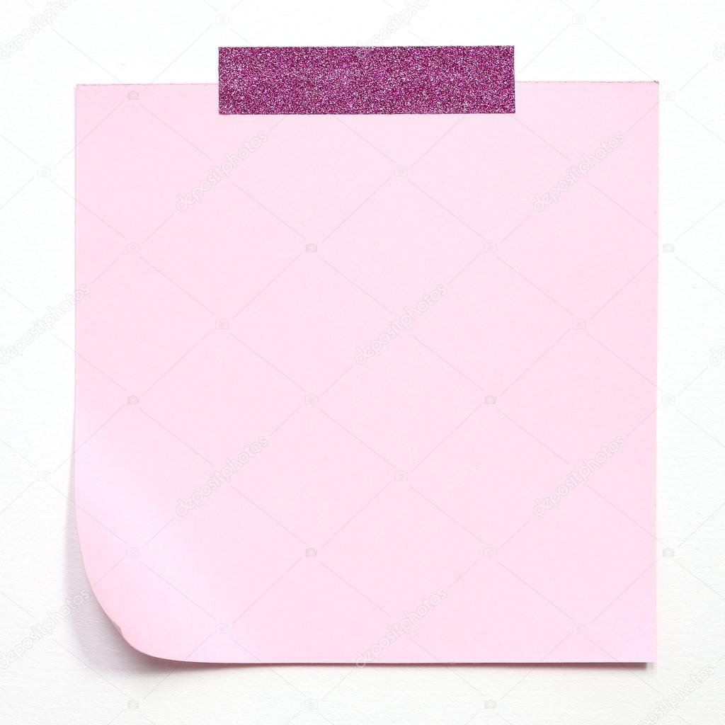pink paper note with tape on white background