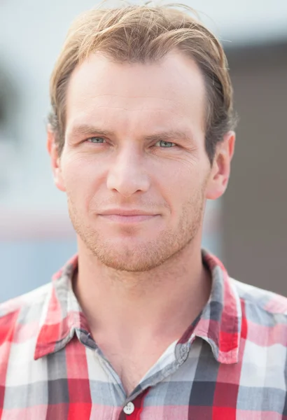 Portrait of man in a checkered shirt — Stock Photo, Image