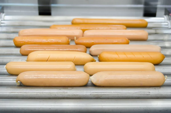 Mix sausages on hot dog broiler — Stock Photo, Image